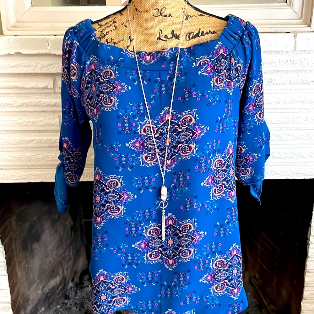 Classic BoHo blouse. fun to wear & accessorize. Unique quarter sleeves w/ties